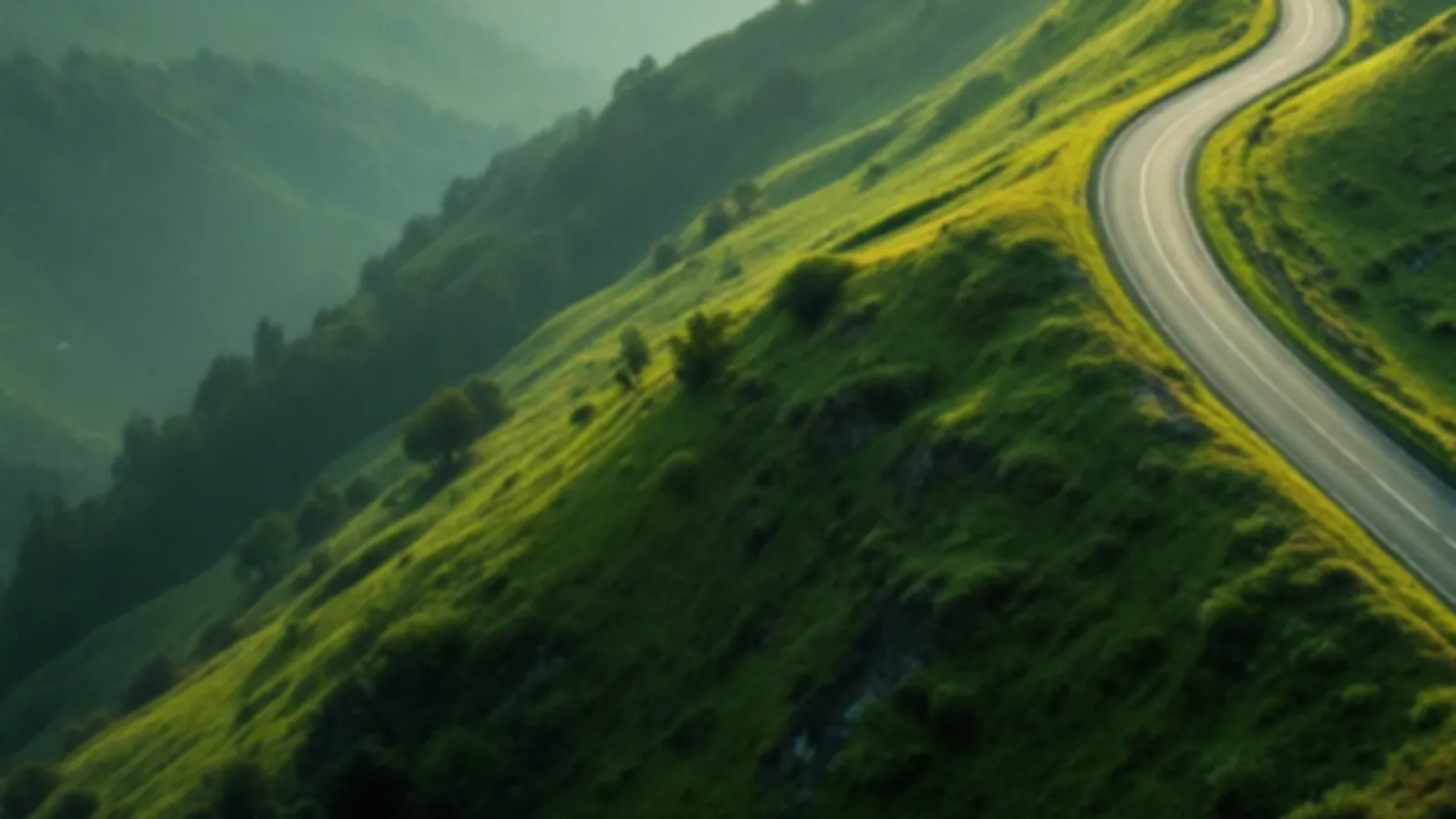 An empty switchback road climbing a green hillside in soft morning light, the CoupeNote view of installment loans online, $100 – $5,000